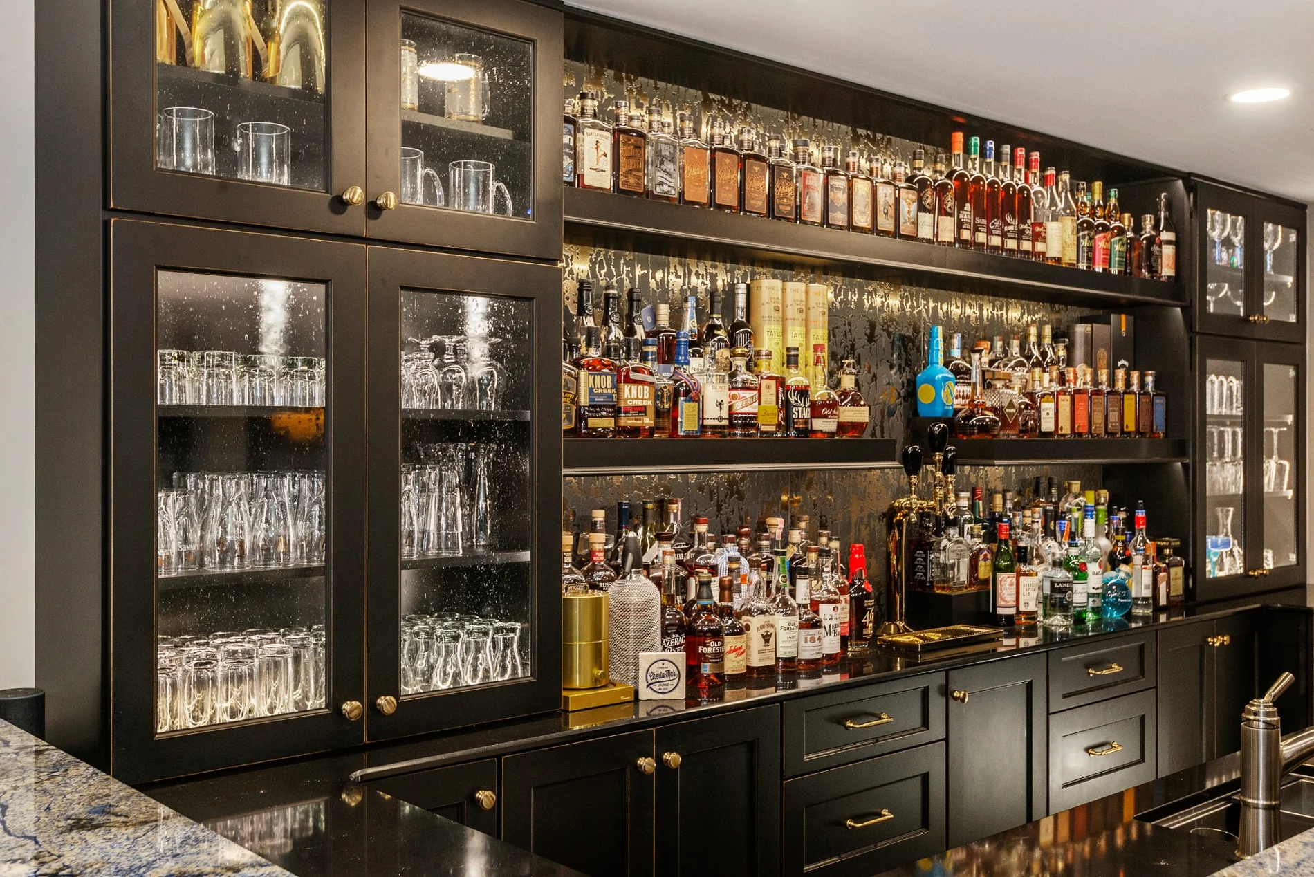 Specialty bar cabinetry showing storage and glass-front doors